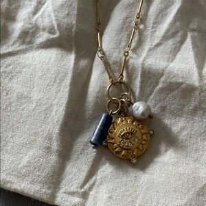 Gold Sun Eye Pendant Necklace with Blue Accent and White Pearl